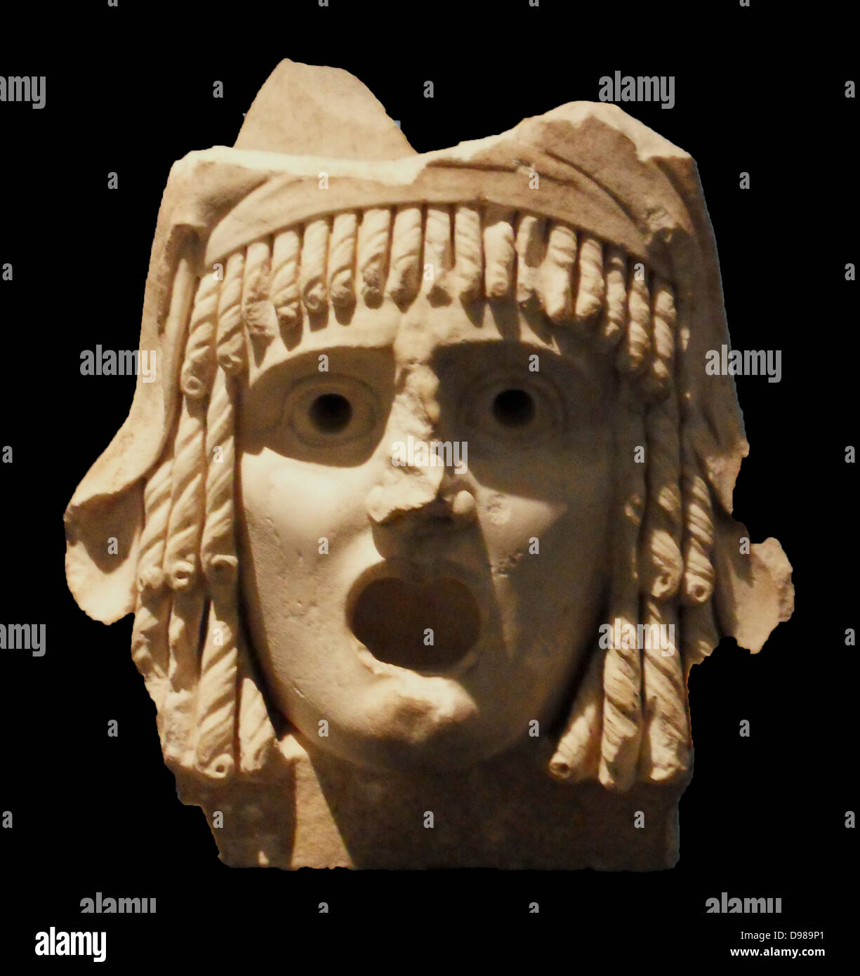 Tragic masks.  Pair of tragic masks, first century BC to first century AD.  A tragic king and a tragic heroine; said to have come 'from a theatre'.  A Roman period rendition in marble of the kind of wooden masks that were worn by actors in classical Greece. Stock Photo
