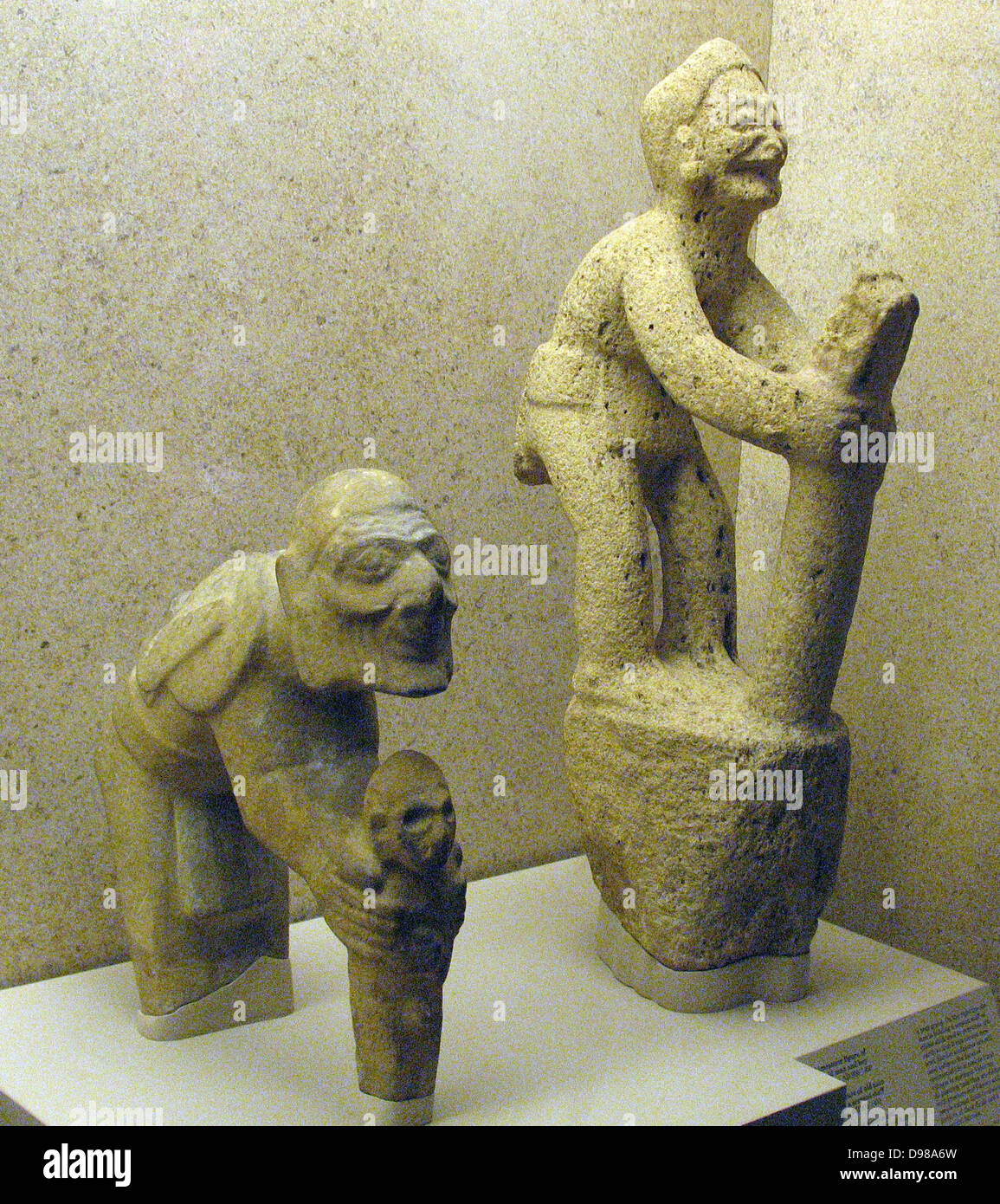 Limestone figure of an old man and boy Huaxtec, AD900-1450.  The wrinkled features and stooping of the old man suggest that he represents the aged Huaxtec thunder god 'Mam'. Stock Photo