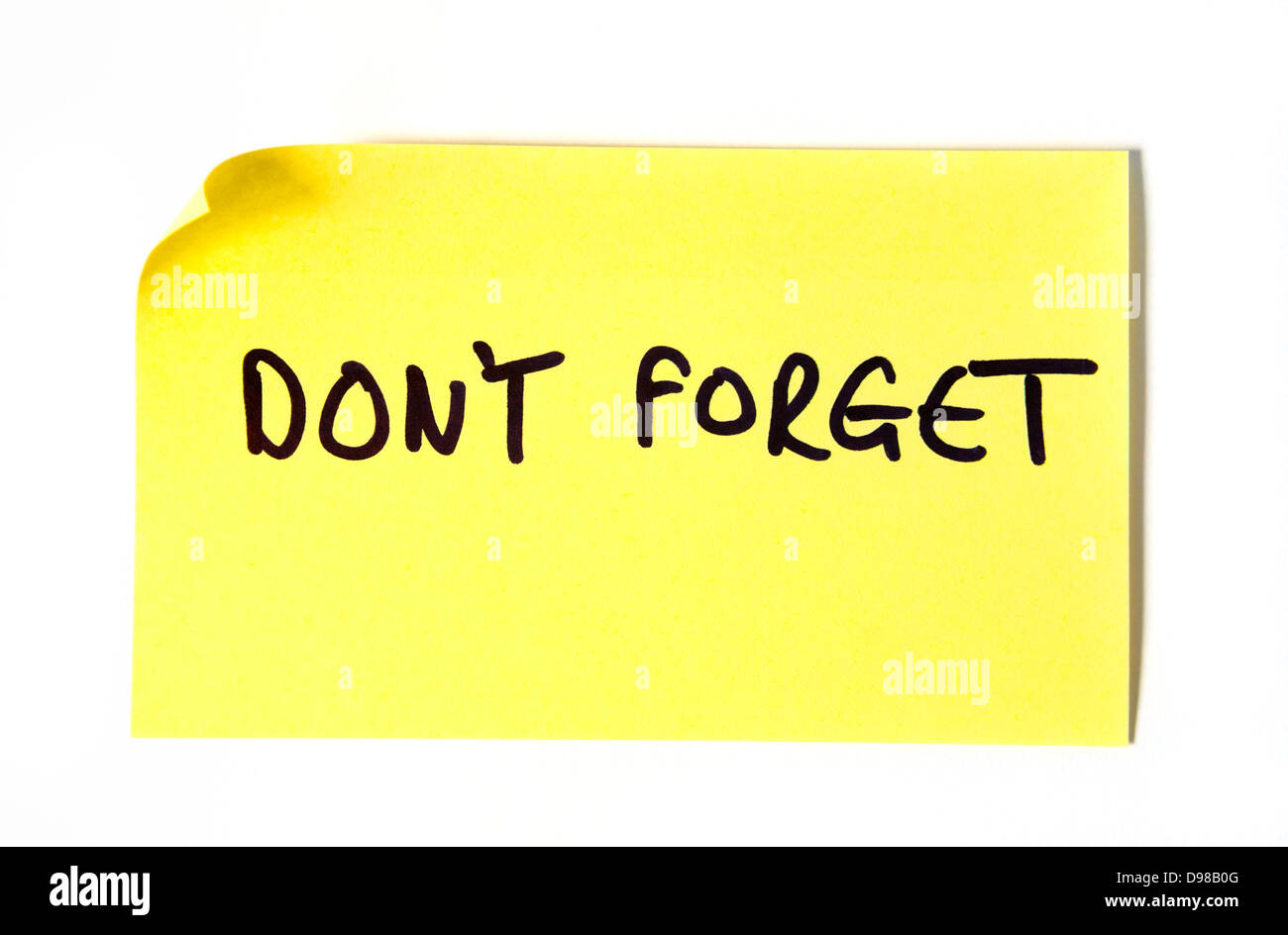 Don't written in capital letters on a yellow post it note Stock