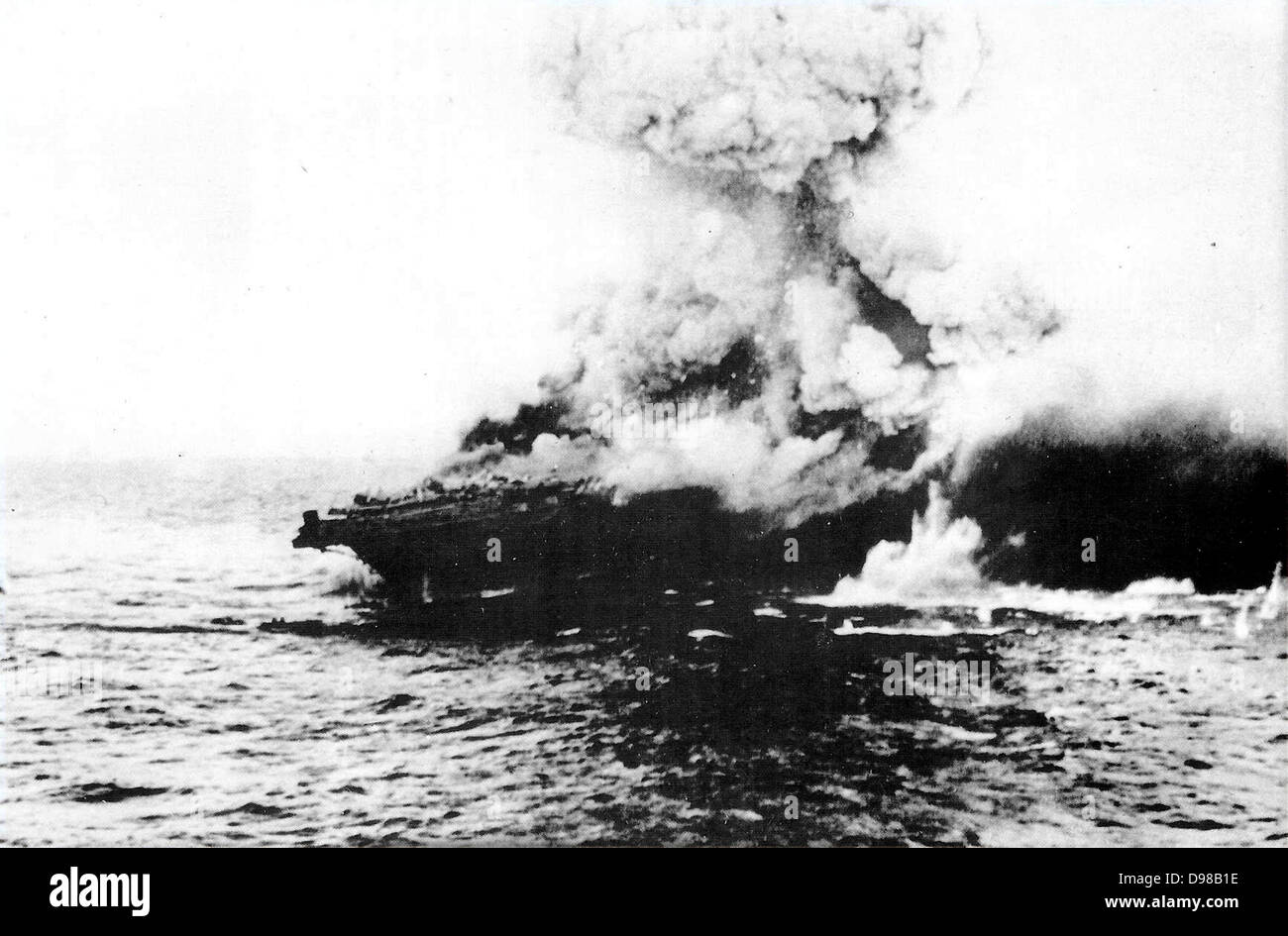 Lexington, an American aircraft carrier was sunk 7th May 1942 by torpedoes and bombs from the Japanese Navy. She first seemed to survive the bombing, but after a series of internal explosions, the ship was doomed.  The Battle of the Coral Sea Stock Photo