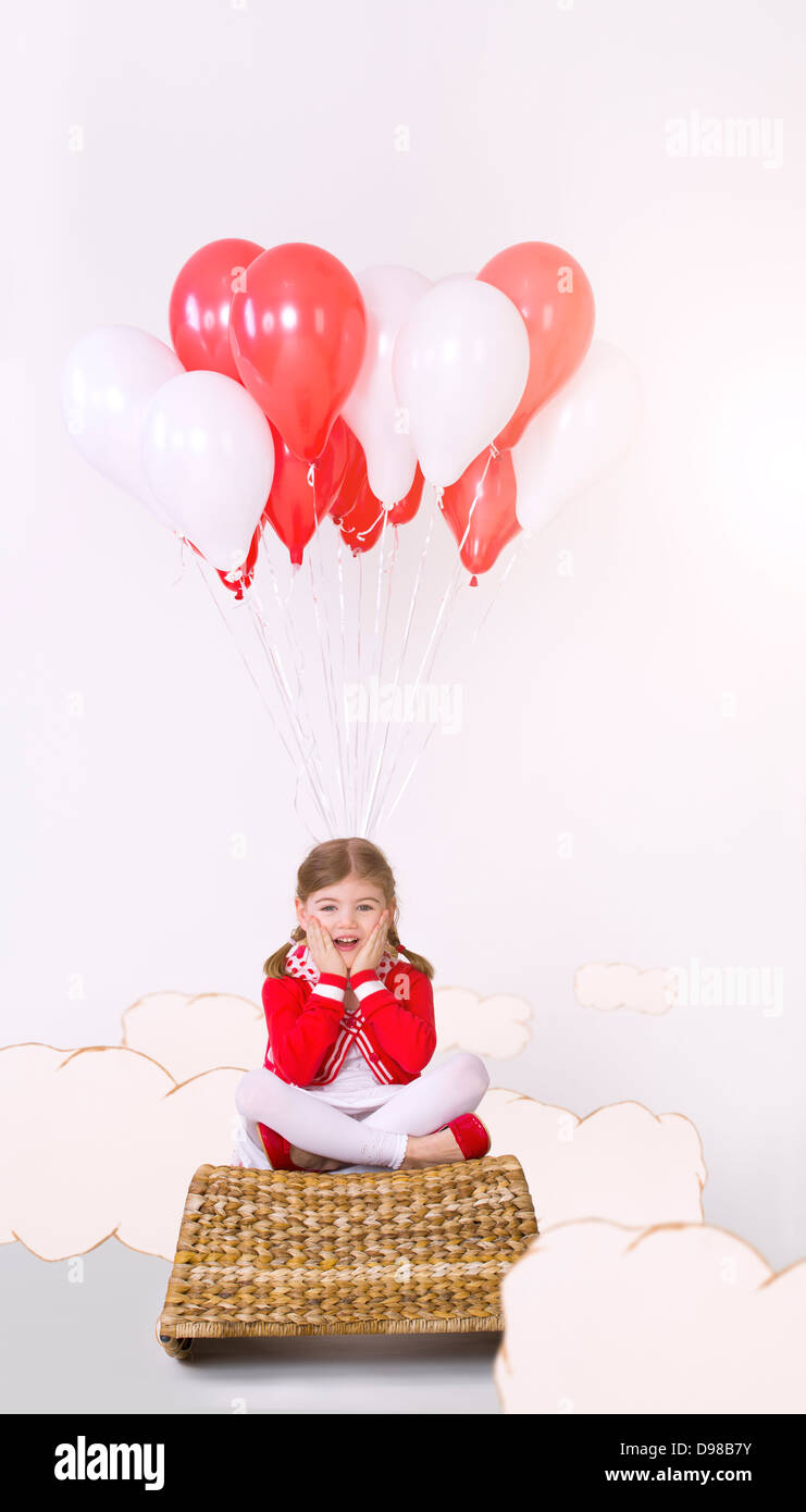 Girl flying bunch balloons hi-res stock photography and images - Alamy