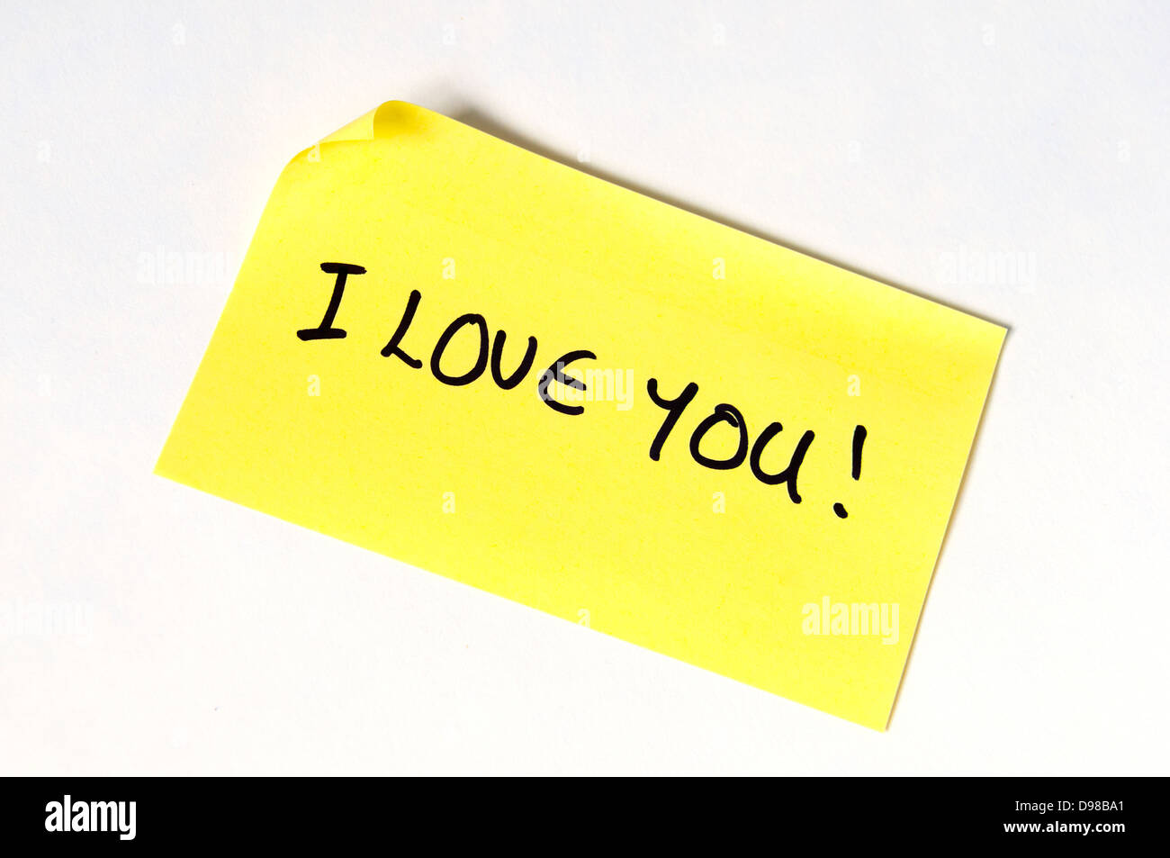 I love you! Written in capital letters on a yellow post it note. Stock Photo
