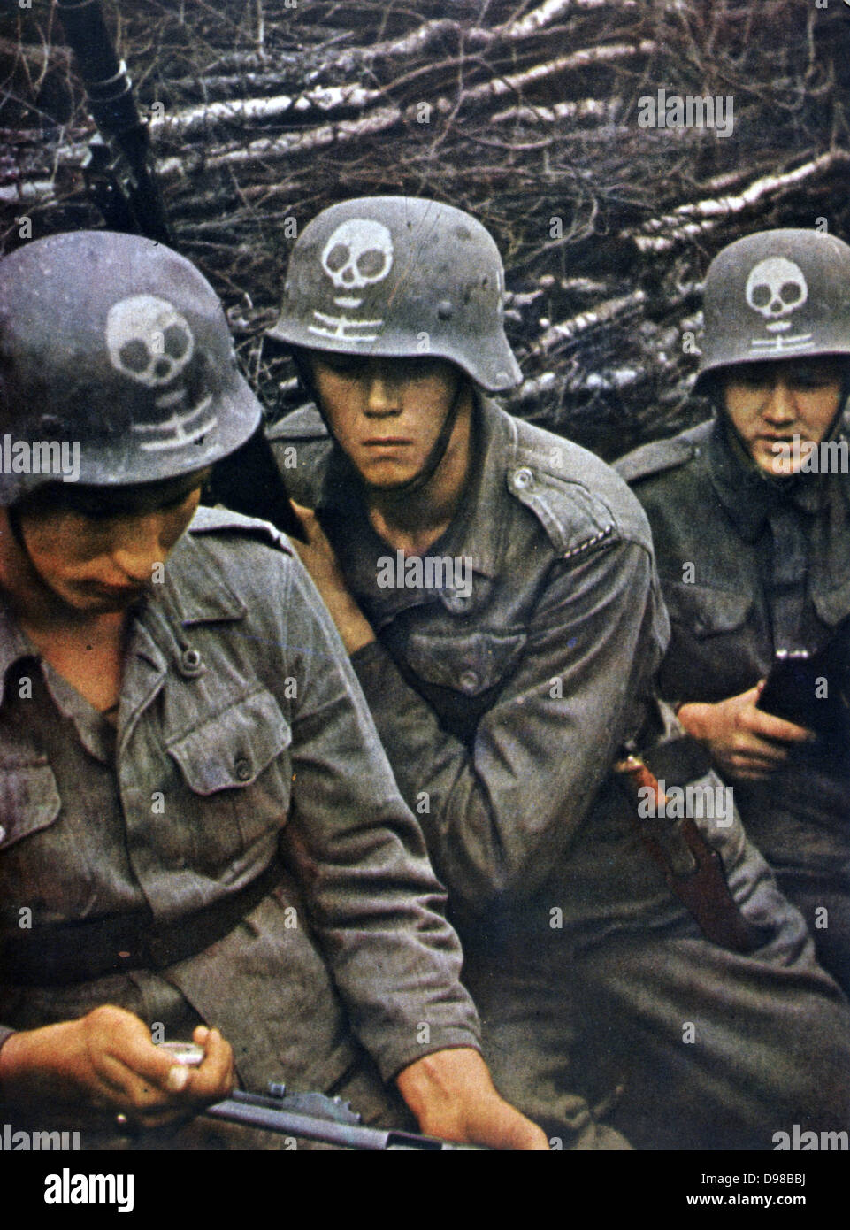 World War II 1939-1945: Group of soldiers from a Finnish regiment wearing tin helmets. From 'Signal', April 1943, German propaganda magazine produced by the Wehrmacht. Stock Photo