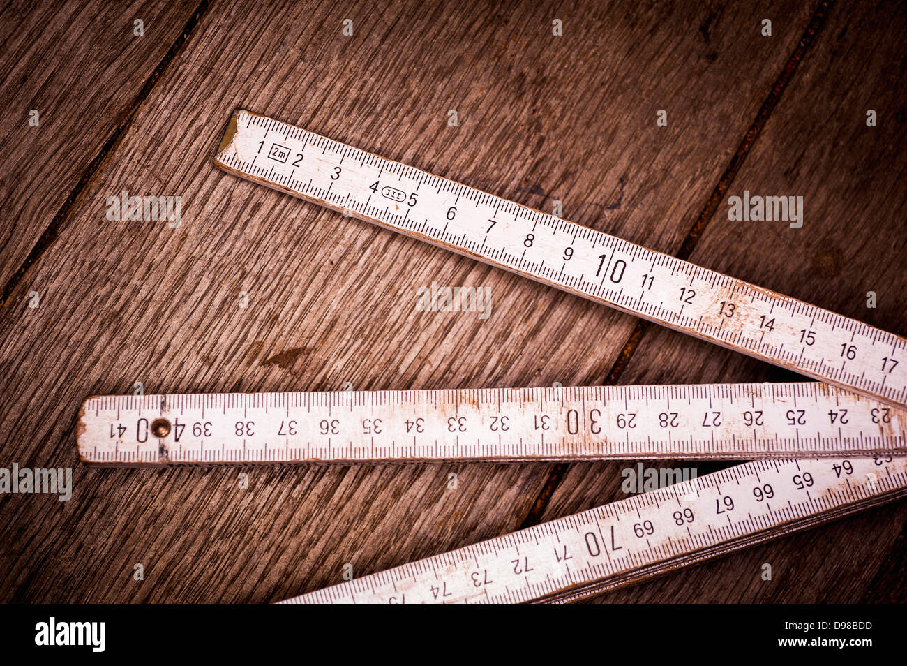 Long Old Ruler Old folding ruler on wooden background, close up Stock Photo - Alamy