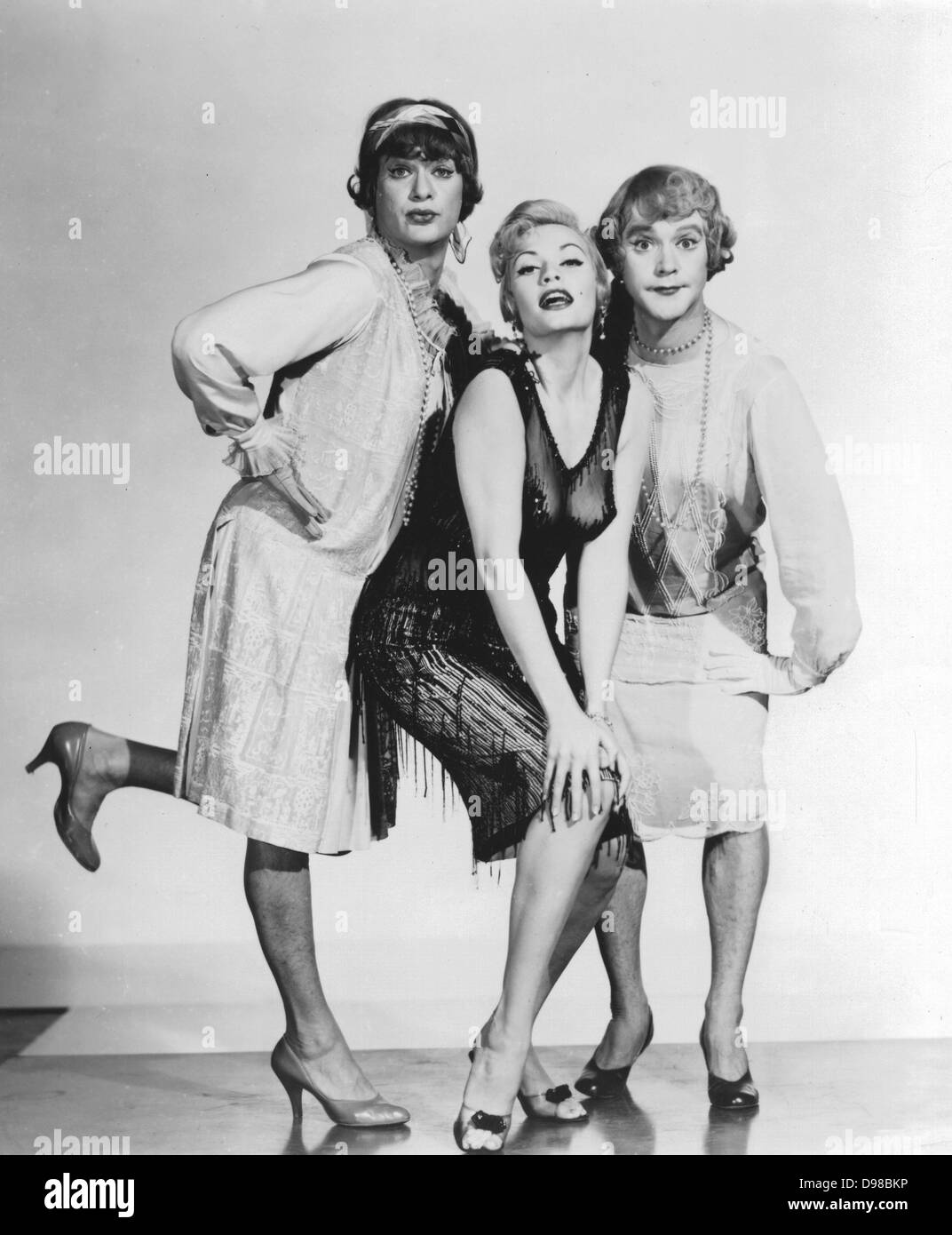 Publicity still for the Hollywood film 'Some Like It Hot' (1959): Director and Producer, Billy Wilder. Marily Monroe with her co-stars Tony Curtis and Jack Lemmon in drag. Stock Photo