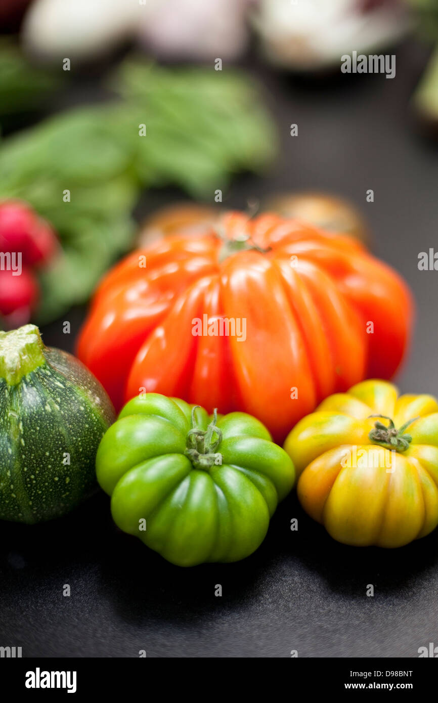 Germany, Duesseldorf, Multicolour tomatoes on table Stock Photo
