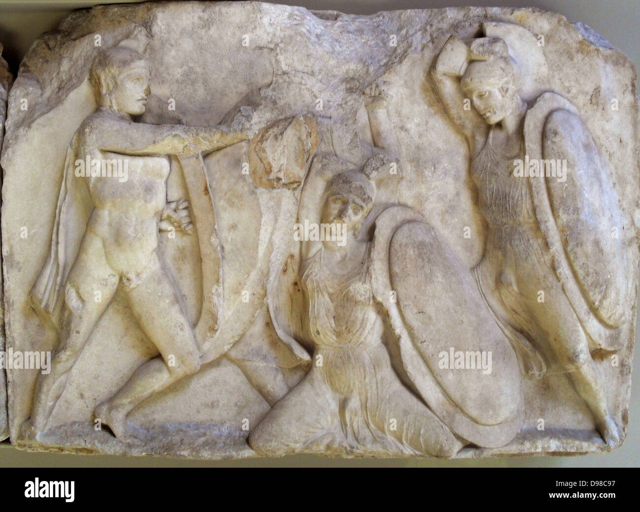 Large podium frieze.  Warriors in combat, either on foot or on horseback. Greek circa 4th-5th century BC Stock Photo