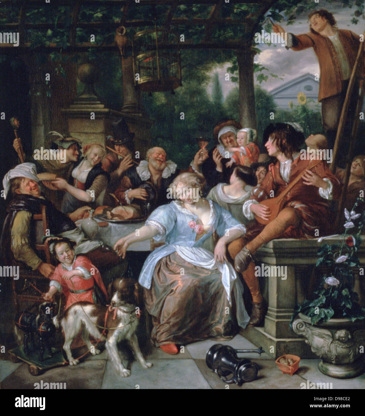 Merry Company on a Terrace': Group eating and drinking in the open air under a pergola from which hangs a bird in a cage. Pet dog harnessed to child's wheeled toy. Young men play flute and mandolin. Jan Steen (1626-1679) Dutch painter. Stock Photo
