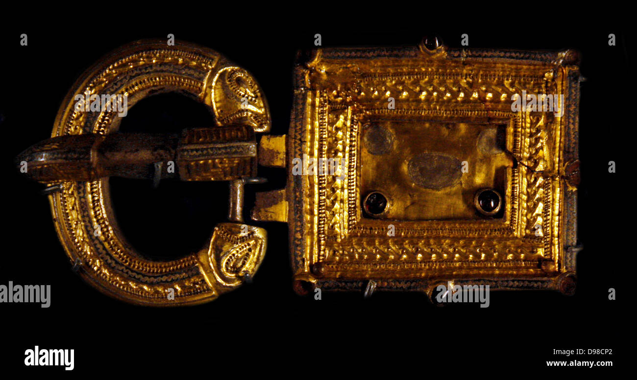 Buckle, silver gilt and garnet.  500-600, Belluno, Italy. Stock Photo