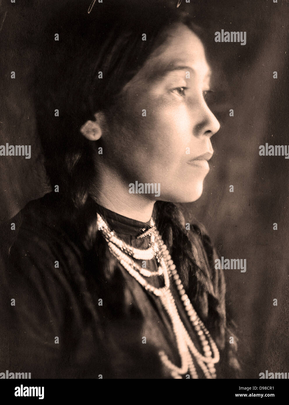 Head-and-shoulders portrait, facing right, of Native American woman by, 1907. Photograph by J.A. Haran. Stock Photo