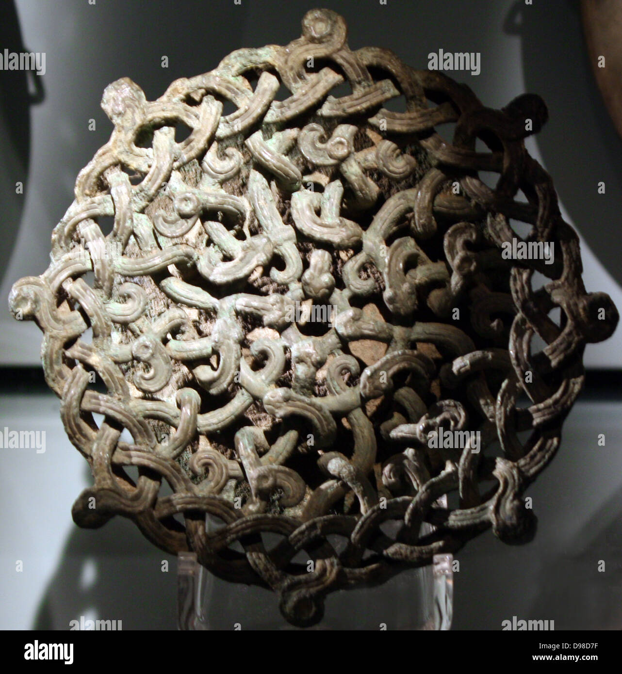 Bronze lid fitting with intertwined serpents in openwork designs ...