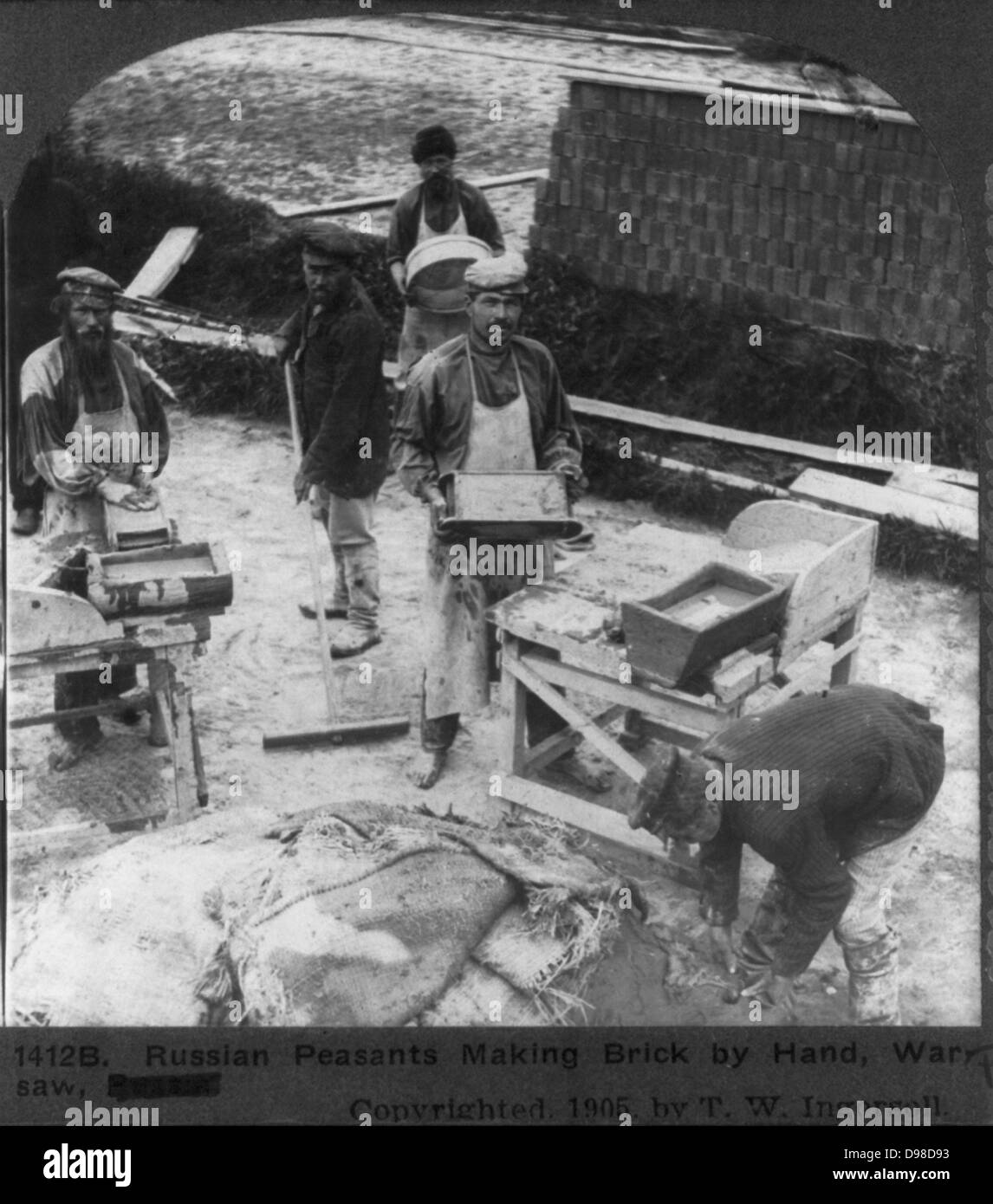 Moulding and stacking bricks before firing: Russian brickyard, c1905. Stock Photo