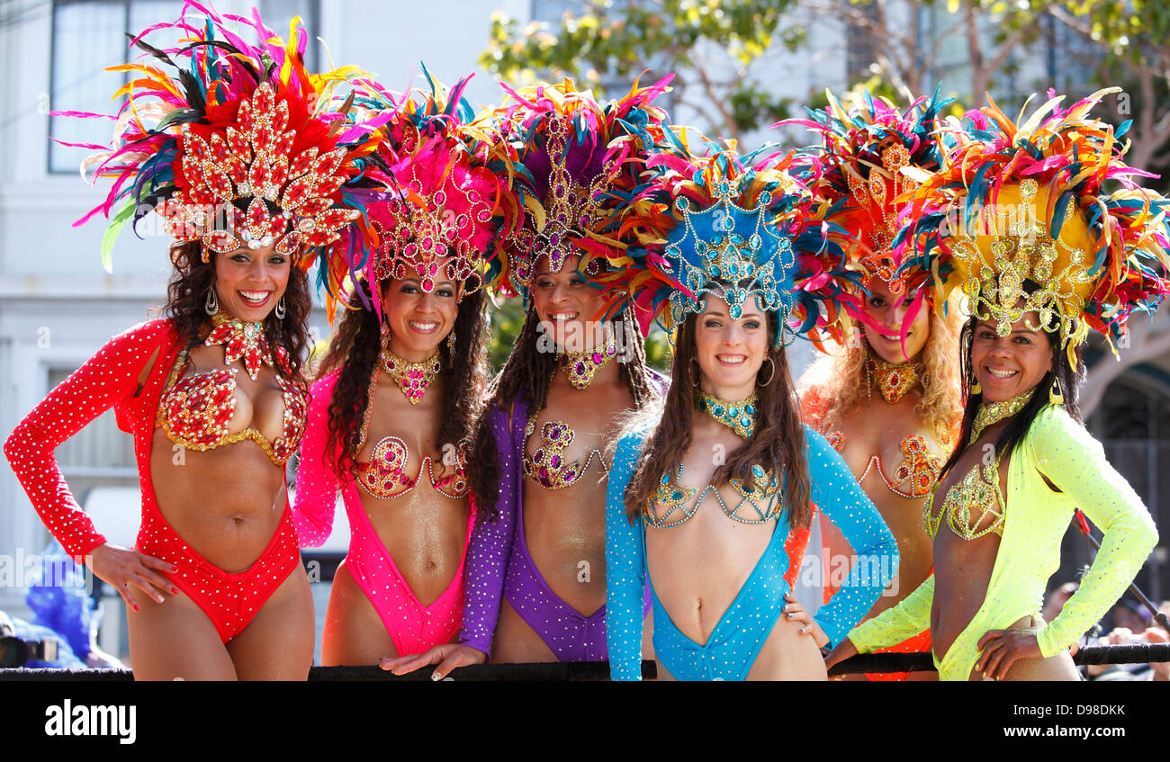 Colorful, pretty dancers with headdresses during carnaval in Misssion district, San Francisco, California, USA. Stock Photo