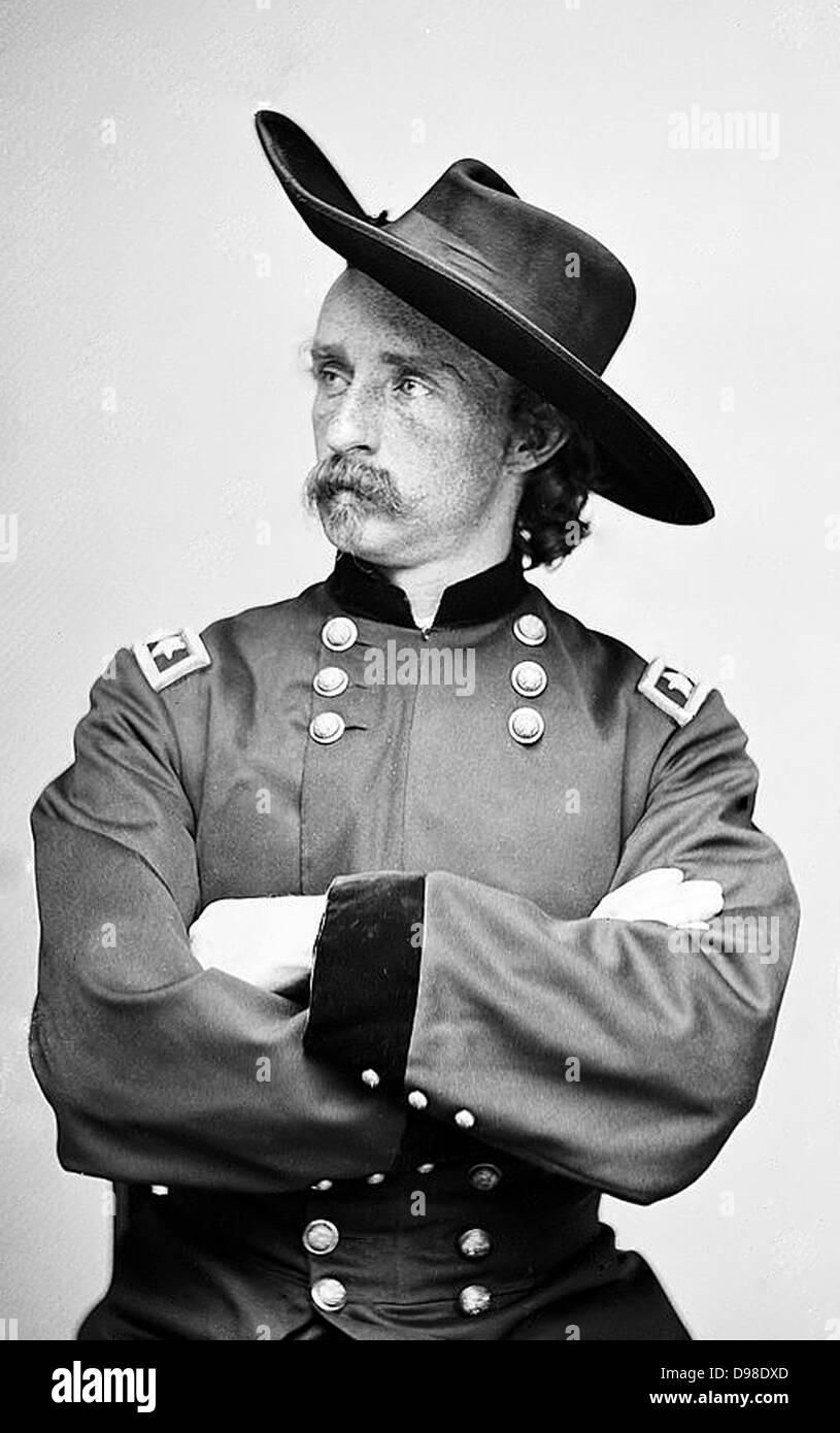 George Armstrong Custer (1839-1876) United States Army office and cavalry commander in American Civil War and Indian Wars. Defeated and killed at Battle of Little Bighorn in what iscalled Custer's Last Stand. Photograph in uniform, seated. Stock Photo