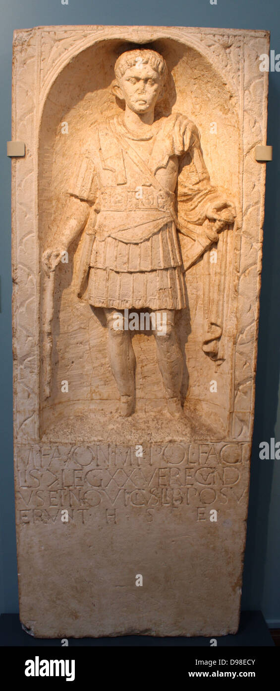 Tombstone of centurion M Favonius Facilis from Colchester, AD 43-50.  He wears the full armour of a Roman officer and carries a centurion's vine- rod (vitis).  He served at Camulodunum (modern Colchester), and the inscription records that the monument was set up by two of his ex-slaves, called Verecundus and Novicius.  One of the earliest dated sculptures from Roman Britain. Stock Photo