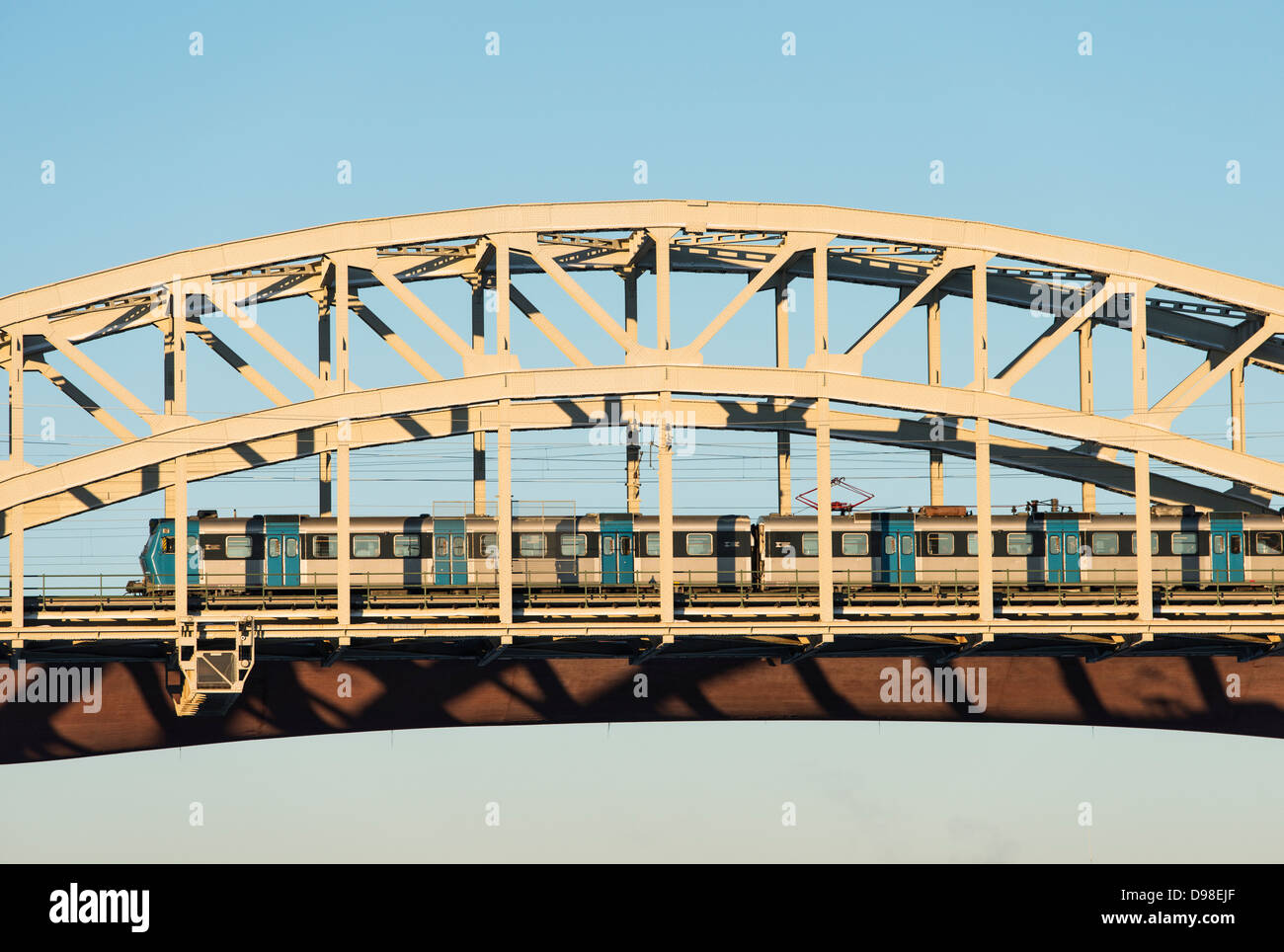 Railway bridge and commuter train, Stockholm, Sweden. Stock Photo