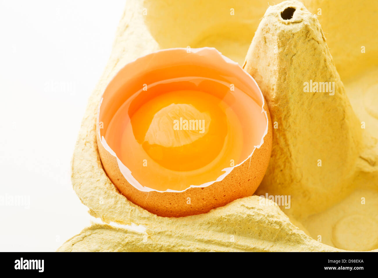 Broken egg in carton, close up Stock Photo Alamy
