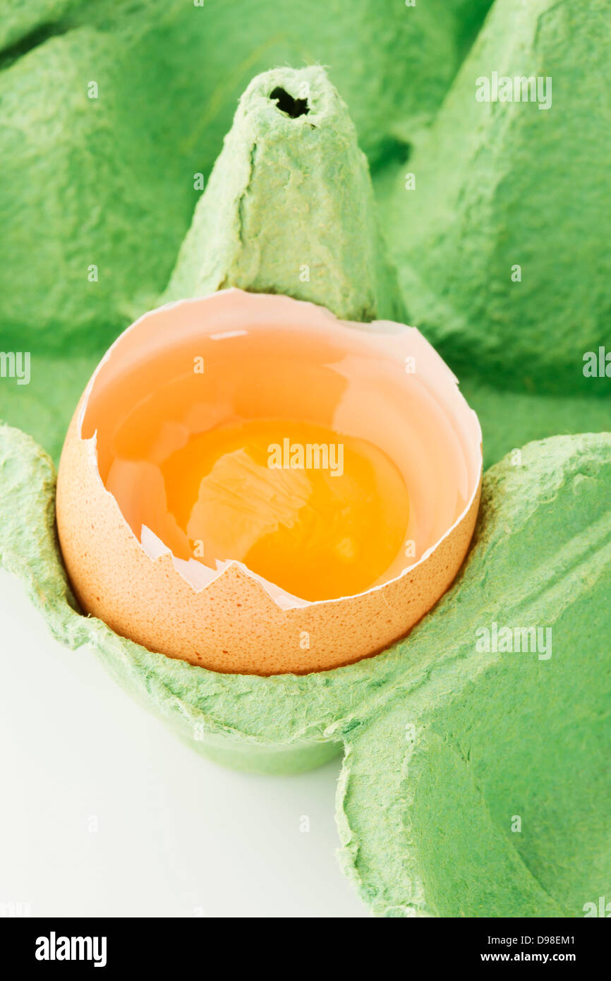 Broken egg in carton, close up Stock Photo Alamy