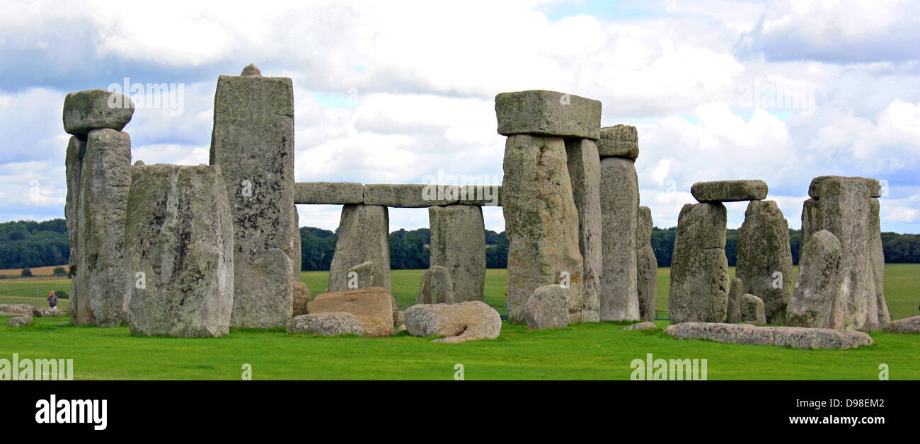 Stonehenge is a prehistoric monument located in the English county of Wiltshire, one of the most famous sites in the world.  It is composed of earthworks surrounding a circular setting of large standing stones.  It is the centre of the most dense complex of Neolithic and Bronze Age monuments in England, including several hundred burial mounts. Stock Photo