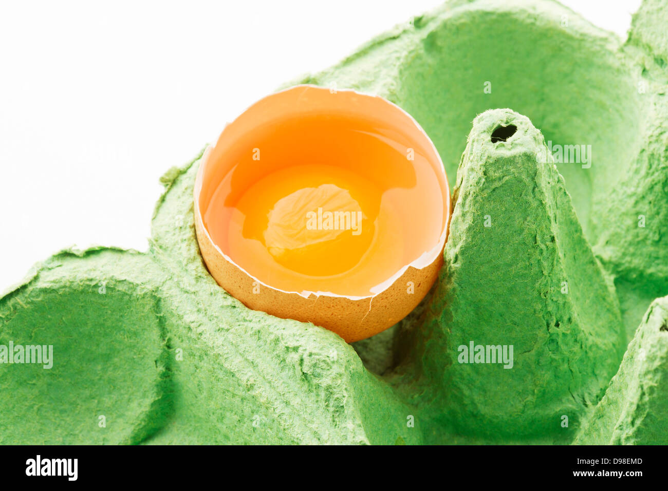 Broken egg in carton, close up Stock Photo Alamy