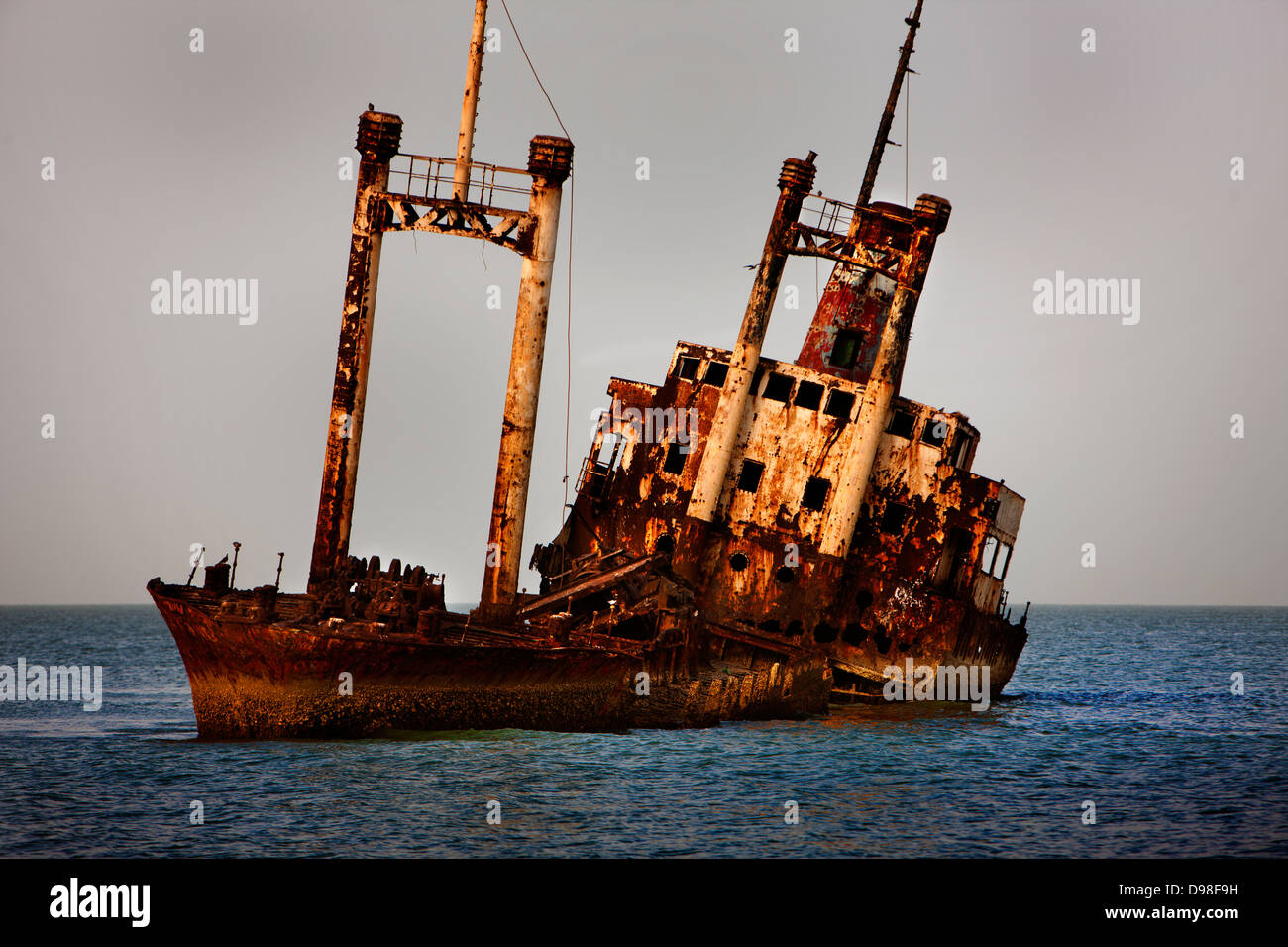 Ship wreck just off the beach near the Royal Lodge, Sine Saloum Delta, Senegal Stock Photo