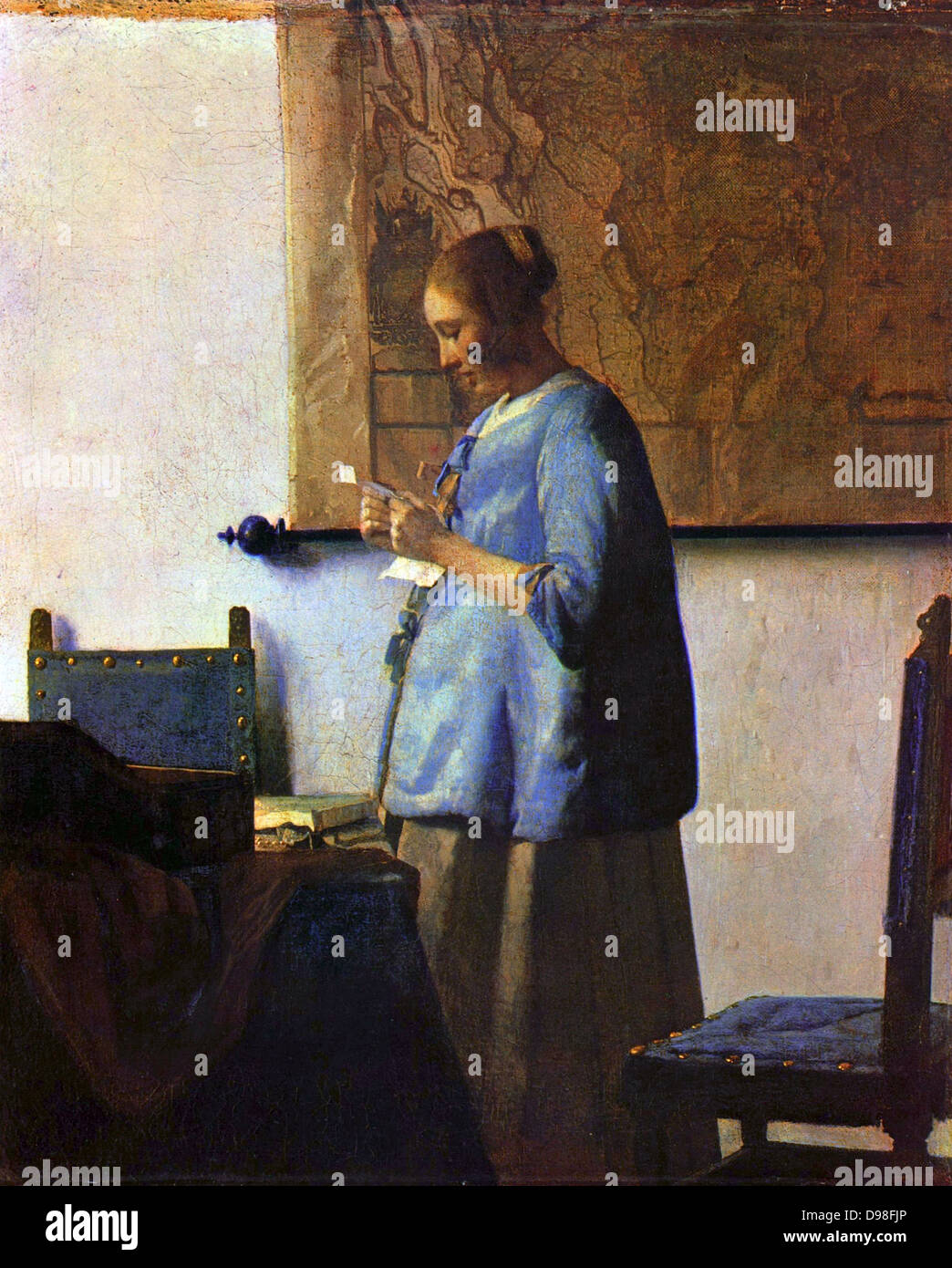 Johannes Vermeer (1632 – 1675 ) Dutch artist. 'Woman reading a letter' or 'Woman in Blue Reading a Letter'. ca. 1662-1663 Stock Photo