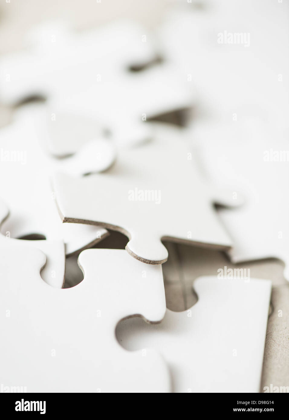 Closeup of white puzzle pieces Stock Photo