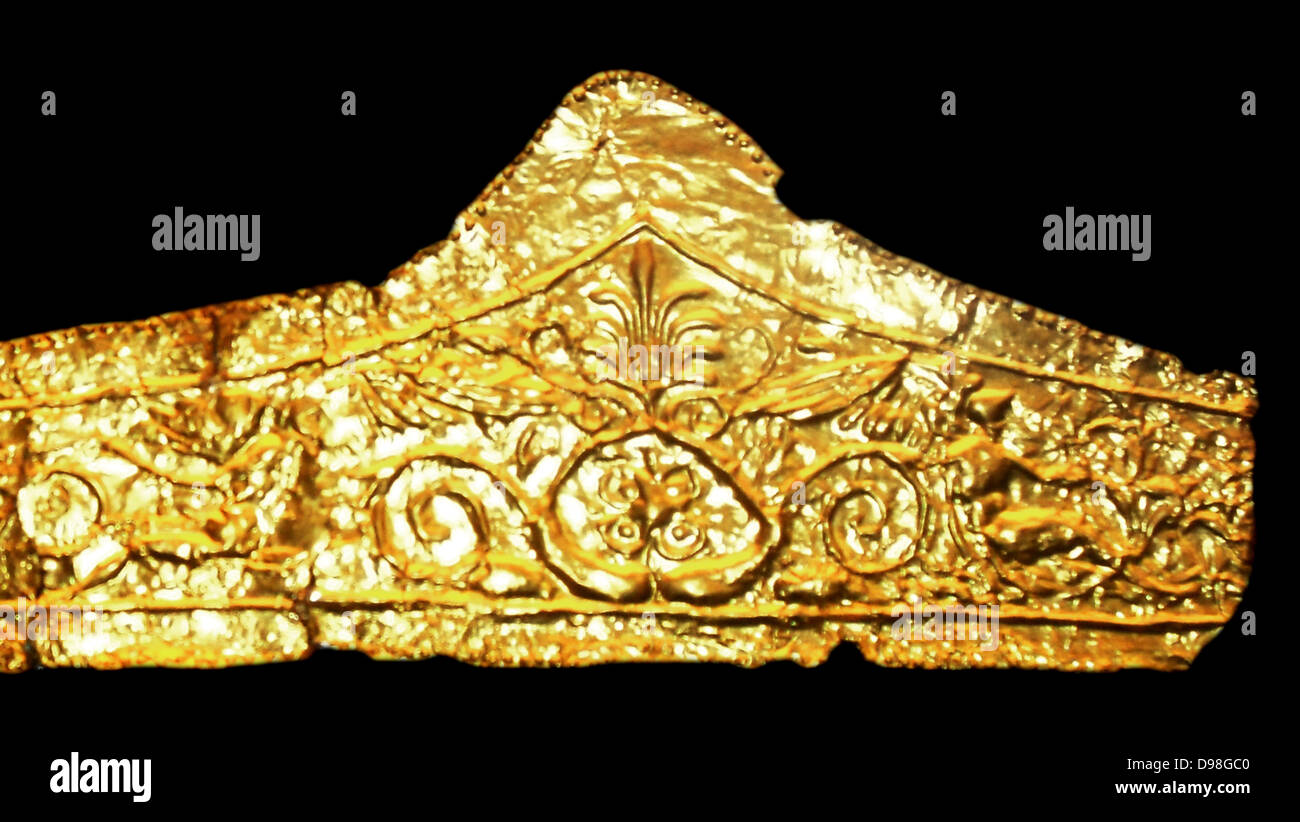 Gold pediment-shaped diadems 330-300BC. These diadems are made of thin sheet gold with die-formed designs.  The most elaborate of them has a central palmette and winged figures on either side with scroll work beyond.  The Kyme Treasure contained fragments of at least 11 such diadems; they were probably especially made for the tomb. Stock Photo
