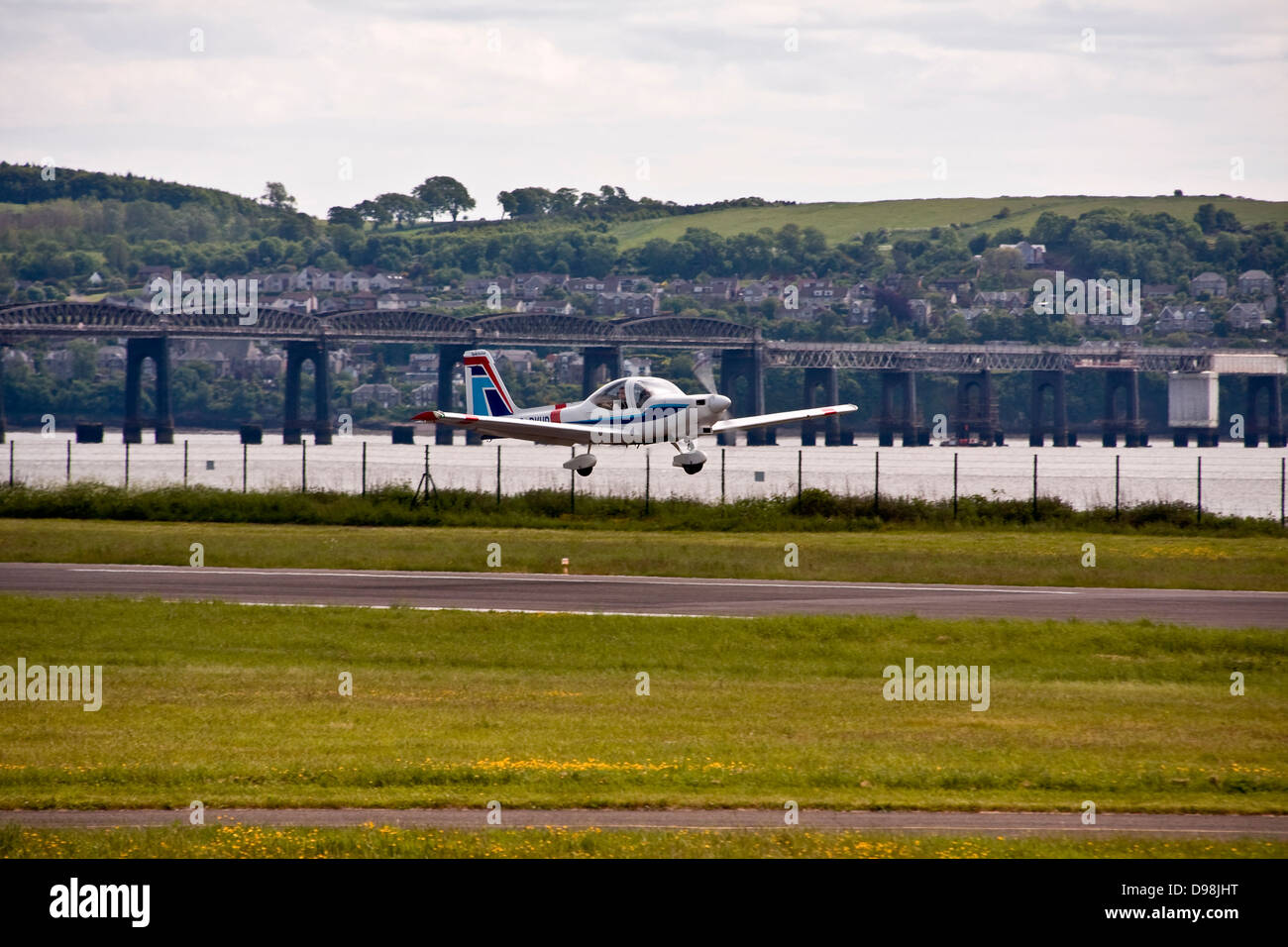 A Tayside Aviation Grob G115 Tutor T.1 / Heron G-BVHG aircraft taking off from Dundee Airport,UK Stock Photo
