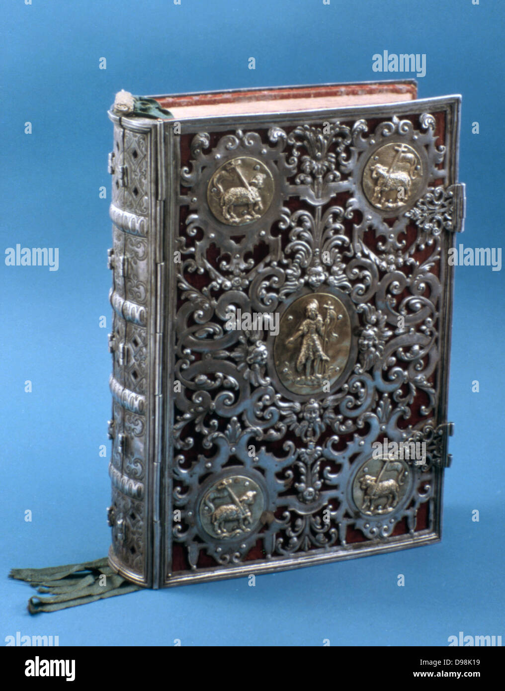 Missal with silver cover with roundels showing the Lamb of God. Liturgical book with text for celebration of Mass through the year. 17th century. Stock Photo
