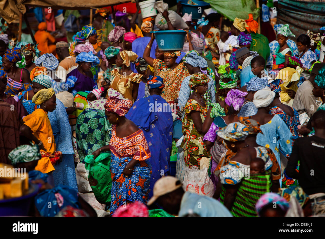 Women buying & selling in a traditional bush market in the village of Mbayefaye Stock Photo