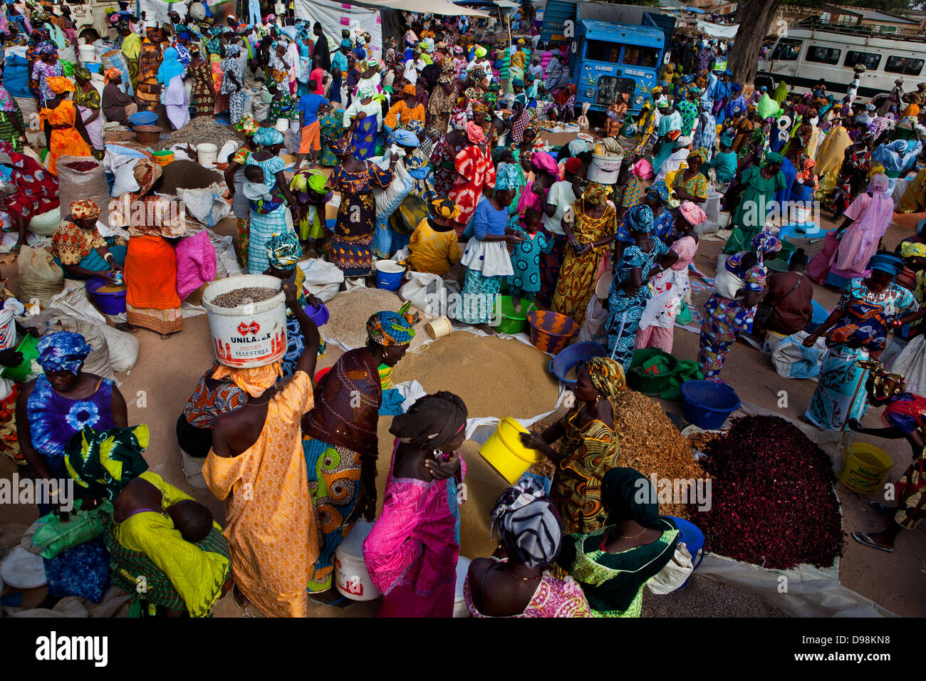 Women buying and selling in a traditional bush market in the village of