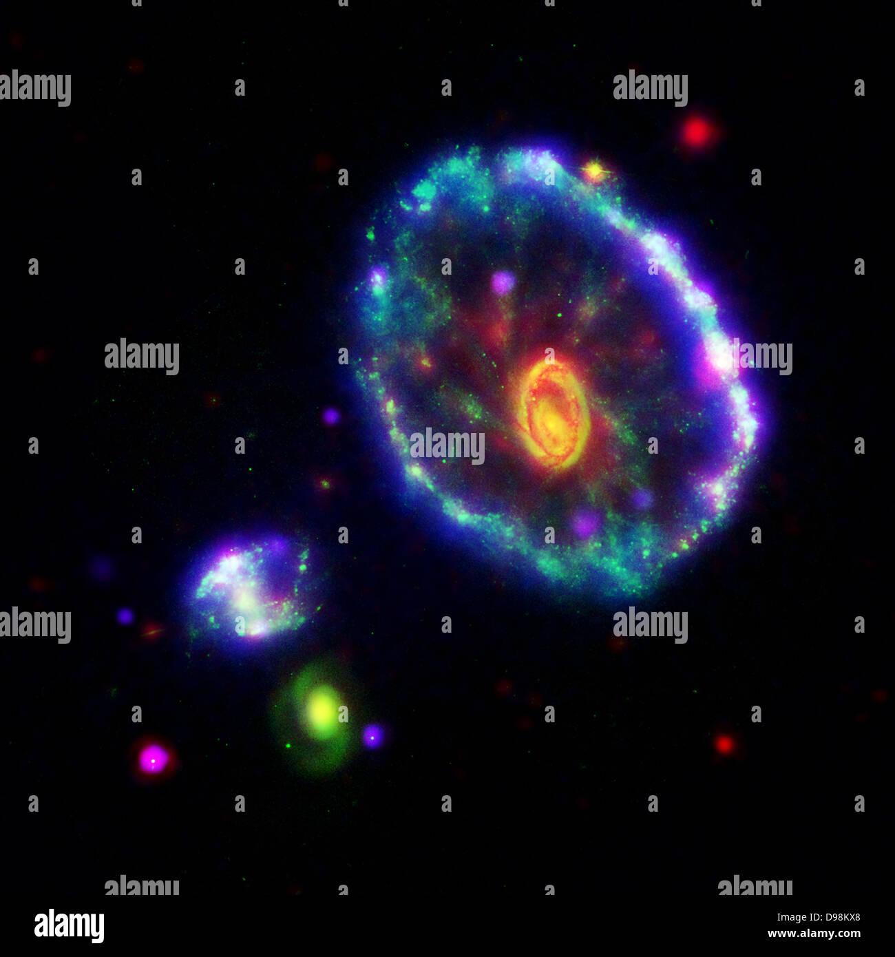 false-colour composite image shows the Cartwheel galaxy as seen by the Galaxy Evolution Explorer's far ultraviolet detector Stock Photo