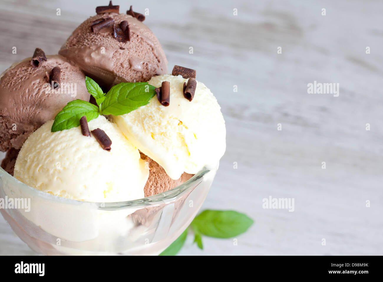 Ice cream vanilla and chocolate on retro table closeup Stock Photo