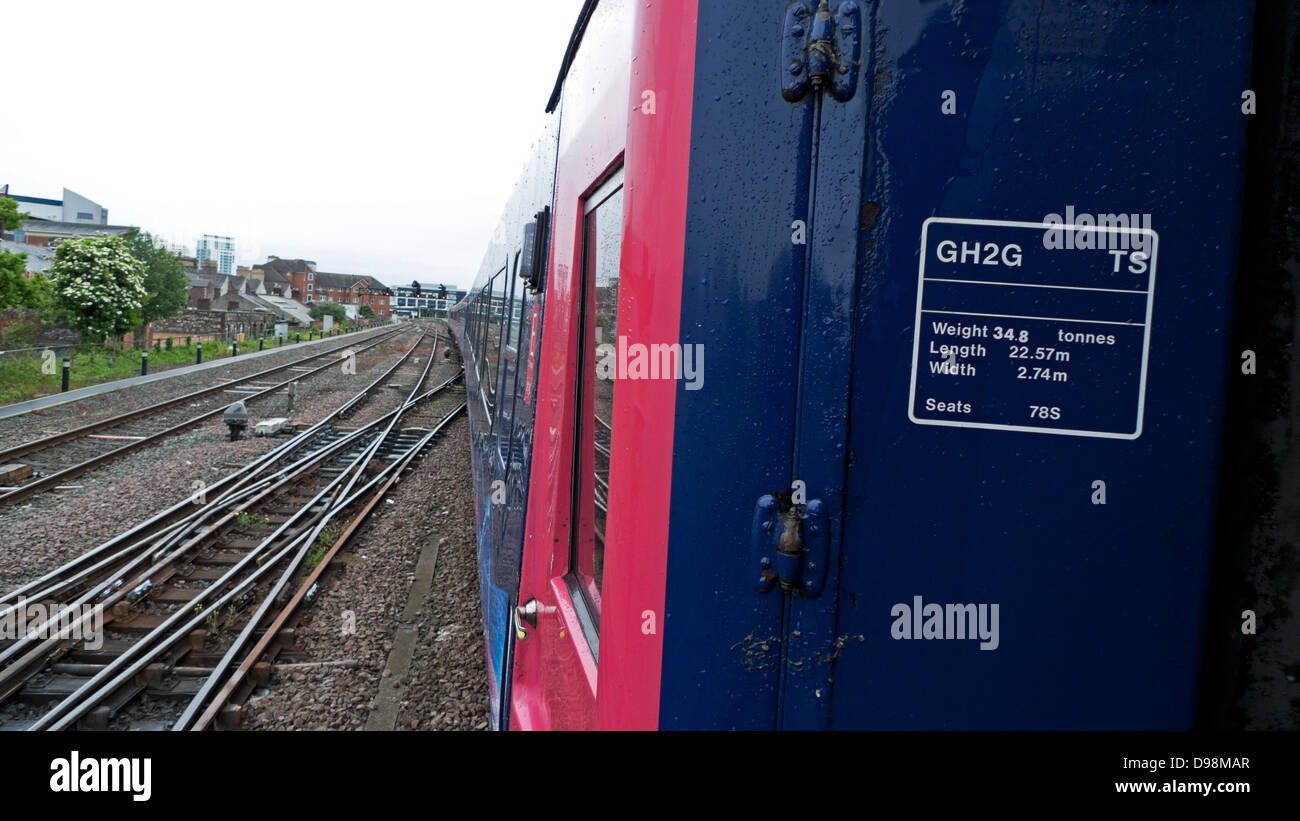 View of the track and side of a Great Western train approaching Cardiff station Wales UK Stock Photo