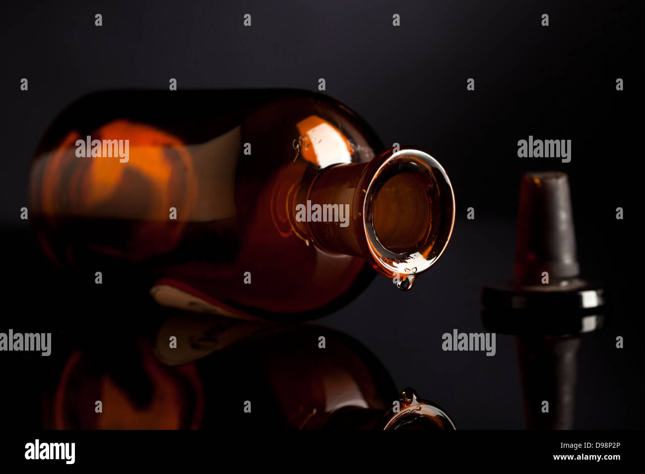 Last drop dripping from old pharmacy bottle Stock Photo Alamy
