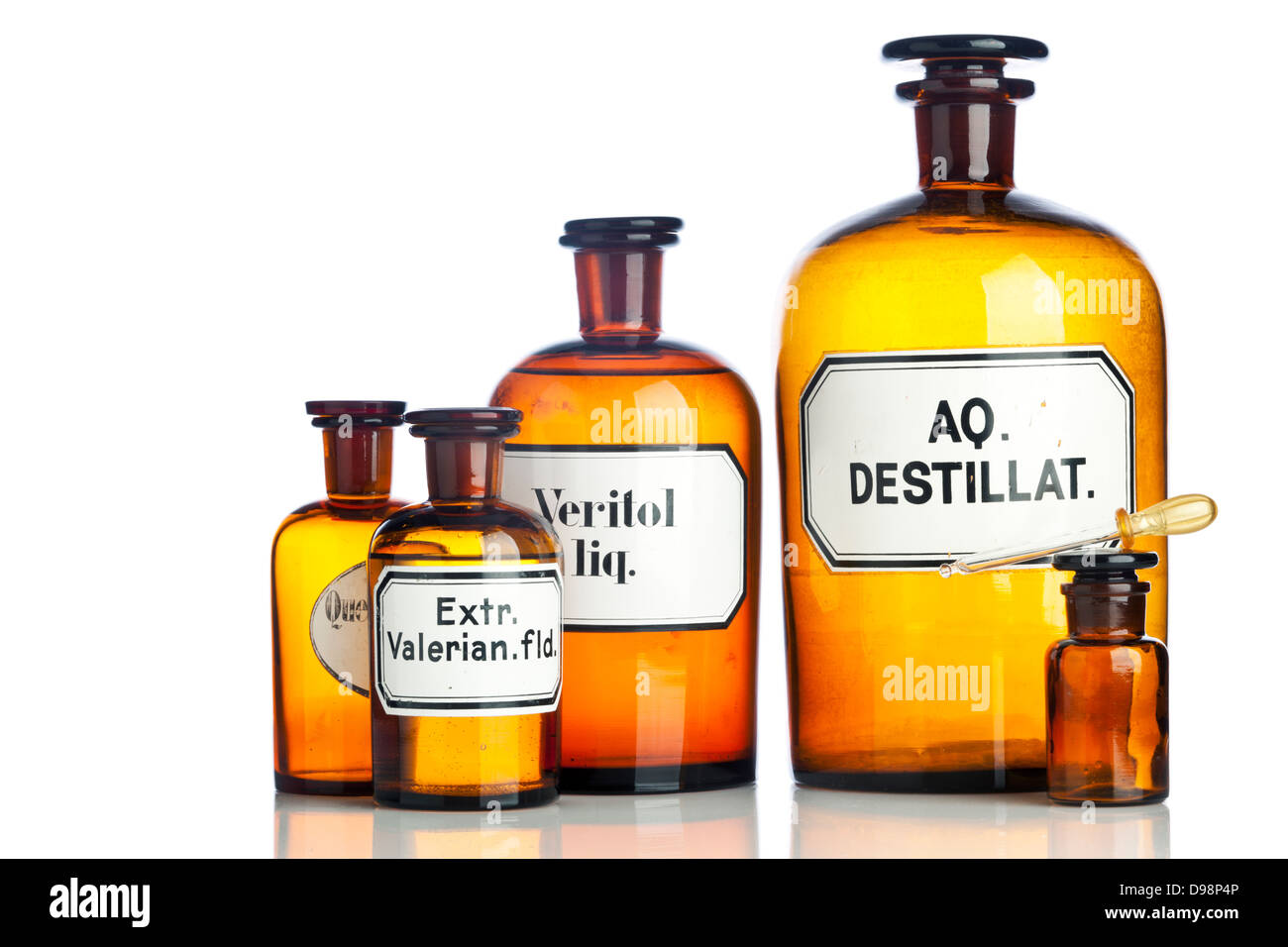Old pharmacy bottles with latin lettering on labels Stock Photo