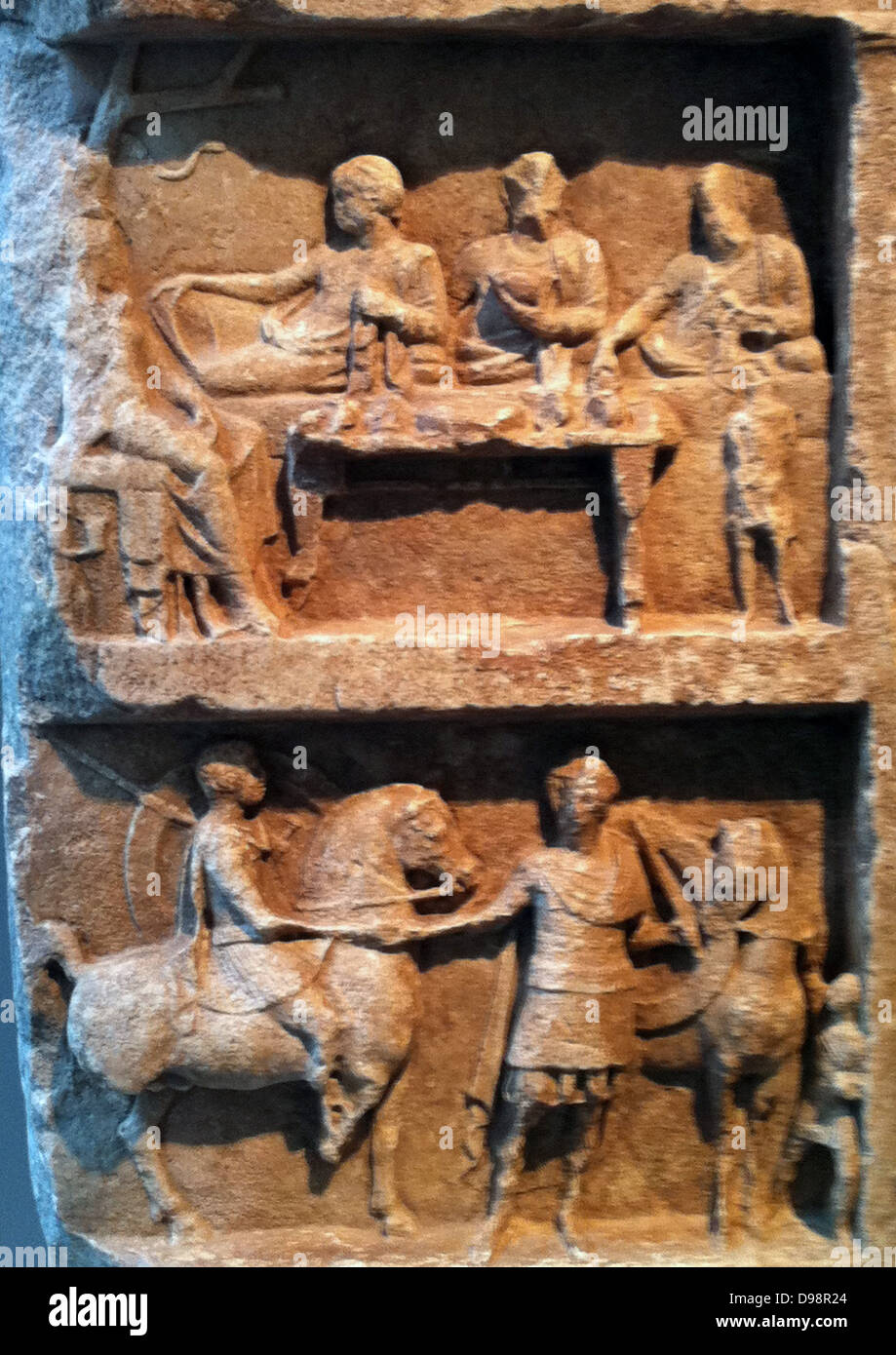 Marble grave relief with a funerary banquet and departing warriors. Greek, Hellenistic 2nd century B.C. Stock Photo