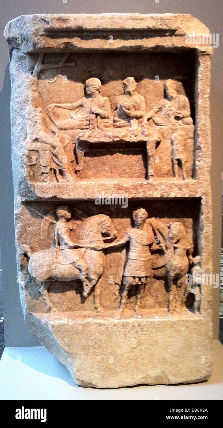 Marble grave relief with a funerary banquet and departing warriors. Greek, Hellenistic 2nd century B.C. Stock Photo