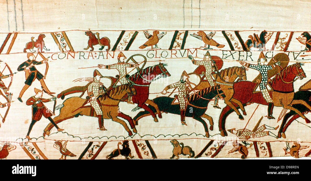 Bayeux Taestry 1067: Battle of Hastings, 14 October 1066. Norman cavalry with spears and shields, backed up by archers, charging towards English. Norman Invasion Anglo-Saxon Textile Linen Stock Photo