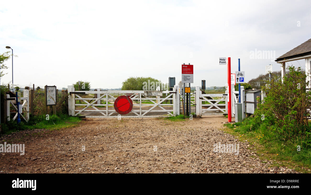 An unmanned rail level crossing by Buckenham Station, Norfolk, England, United Kingdom. Stock Photo
