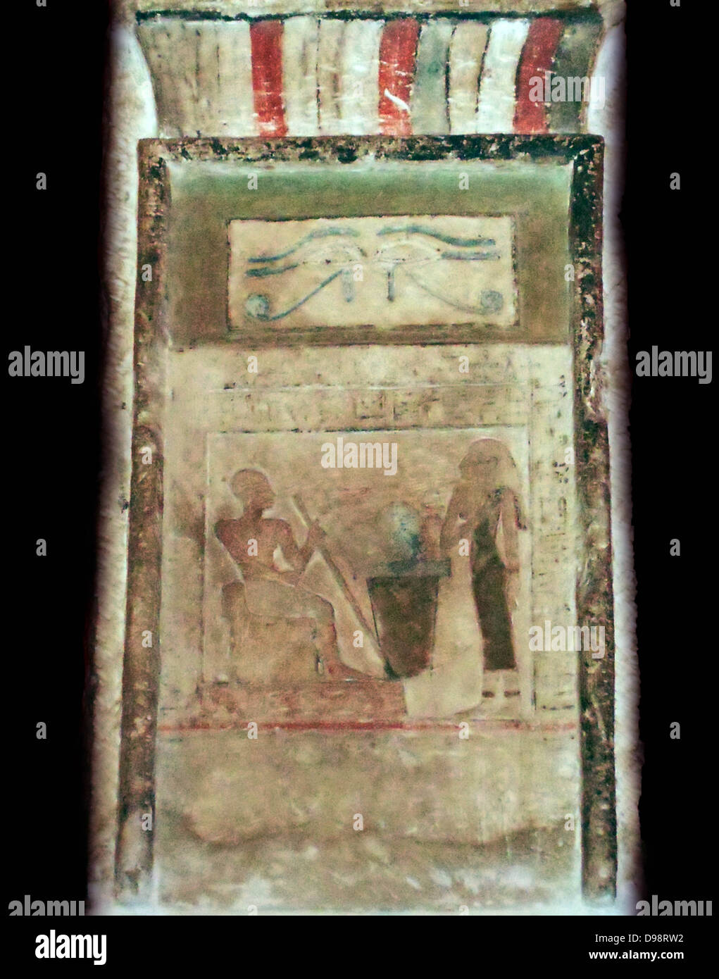 Stele of Imenyseneb (2123-2040 BC), Egyptian painted limestone section from a Stella (stele). Imenyseneb is served by his wife under the protective symbol of the Wedjet eye. Imenyseneb was chief of expeditions for the royal court of the Pharaoh. Stock Photo