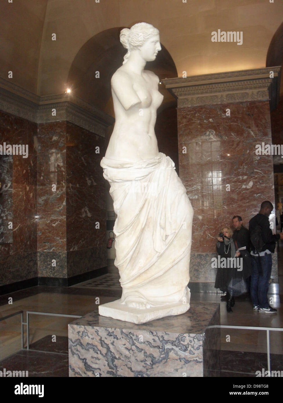 Venus de Milo, is an ancient Greek statue and one of the most famous works of ancient Greek sculpture. Created at some time between 130 and 100 BC, it is believed to depict Aphrodite (Venus to the Romans) the Greek goddess of love and beauty. It is a marble sculpture, slightly larger than life size at 203 cm (6 ft. 8 in) high. Its arms and original plinth have been lost. From an inscription that was on its plinth. It is at present on display at the Louvre Museum in Paris. Stock Photo