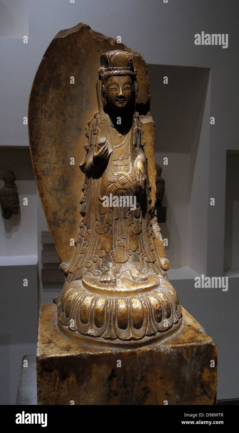 Bodhisattva Avalokitesvara holding a lotus flower.  Wei Dynasty 534-550 AD Chinese Marble. Stock Photo