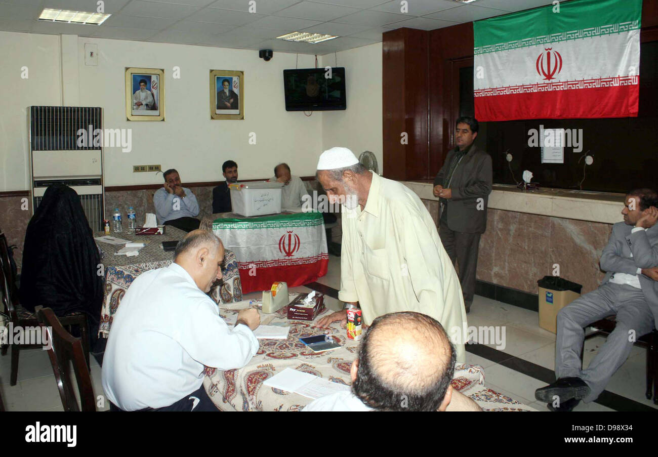 Iranian Nationals casting their ballots during presidential elections 2013 of Iran, at Embassy of Iran in Karachi on Friday, June 14, 2013. A senior Iranian cleric says unlike other countries, a massive voter turnout in Iran elections is an asset which boosts the Islamic Republic international standing. Stock Photo