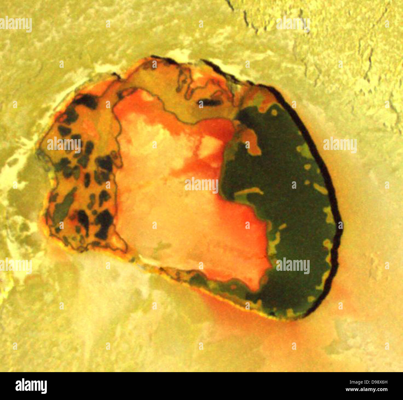 volcanic crater named Tupan Patera on Jupiter's moon Io, as seen in this image from NASA's Galileo spacecraft, show varied Stock Photo