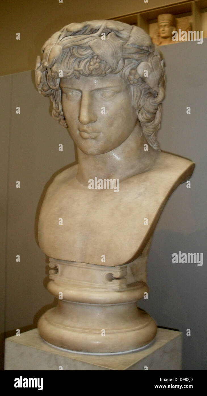 Marble bust of Antinous.  Made in Rome AD130-38.  From the Janiculum, Rome, Italy.  Antinous, Hadrian's lover, was Greek from Bithynia (northern Turkey). He met Hadrian in the 120's and joined his court.  In AD 130 Antinous drowned in the River Nile in Egypt and Hadrian mourned him openly and he was worshipped as a god.  Statues show him as the Egyptian Osiris or, as here, the Greek Dionysus. Stock Photo