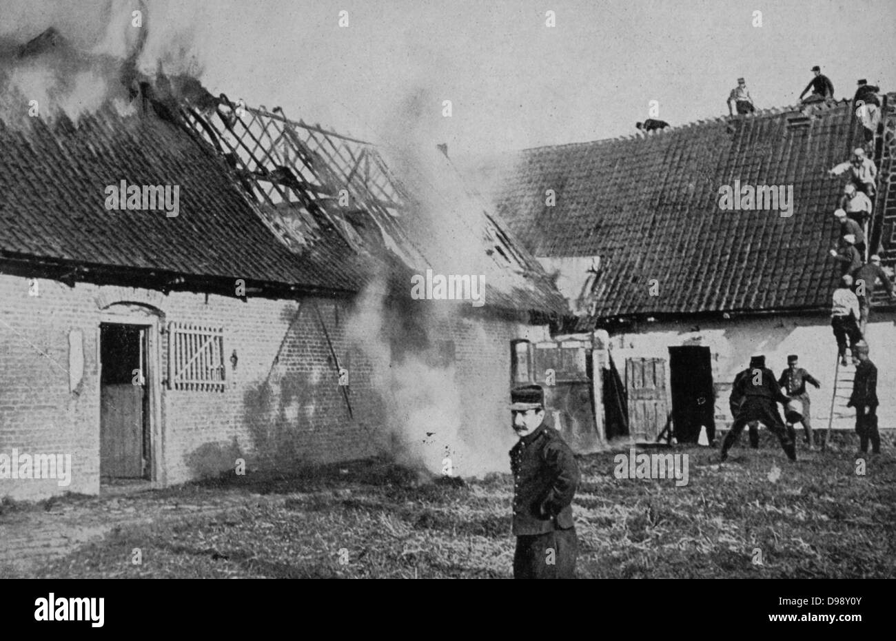 World War I 1914-1918: Fighting a fire on a farm in Artois, France, set alight by German shellfire. Being on the front line between German and Allied forces the area suffered severe damage. From 'Le Flambeau', Paris, 18 September 1915. Stock Photo