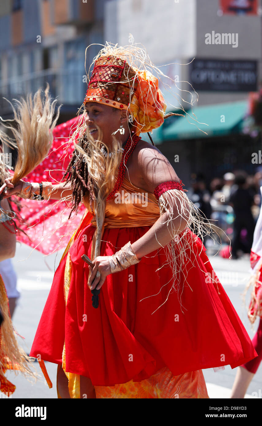Colorful and spirited dancing during carnaval parade in Mission District, San Francisco, California, USA Stock Photo
