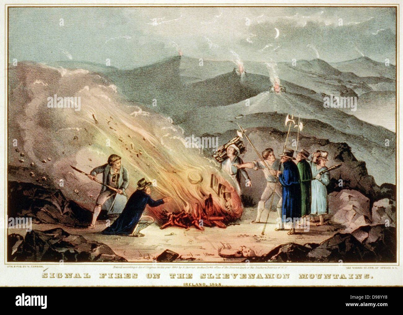 Signal fires on the Slievenamon Mountains - Ireland, 1848 / Lith. & pub. by N. Currier, 152 Nassau St. Cor. of Spruce N.Y.  Currier & Ives--Signal fires on the Slievenamon. Print shows a group of men surrounding a bonfire on a mountaintop during an insurrection in Tipperary. Three men hold weapons while other men tend the fire. lithograph, hand-colored.  c1848 Oct. 2 Stock Photo